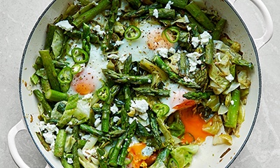 Green baked eggs with new season asparagus
