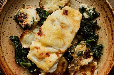 Cod, potato & spinach gratin