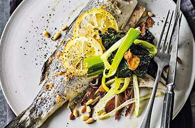 Baked sea bass with raisins, preserved lemon, ginger and coriander