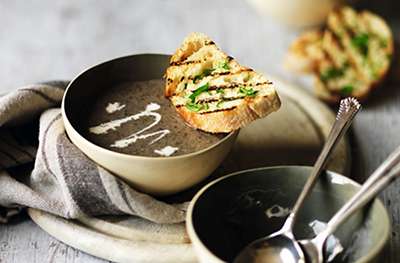 Creamy mushroom soup with garlic toasts