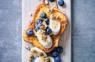 French toast with bananas, blueberries & walnuts