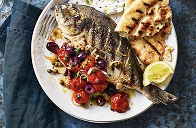 Grilled sea bream with charred tomato & olive salsa