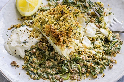Herby crumbed fish with spinach & yogurt lentils