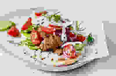 Lamb gyros with tomato salad and garlic yogurt