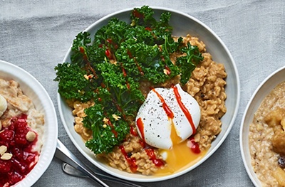 Miso ginger porridge with garlic kale and poached egg