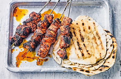 Oregano-marinated chicken kebabs with Greek salad & wraps