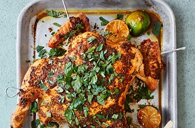 Roast spatchcock chicken with coriander, red chilli and charred limes
