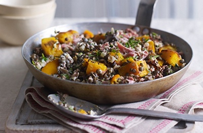 Rosemary-roasted squash with ham hock and lentils