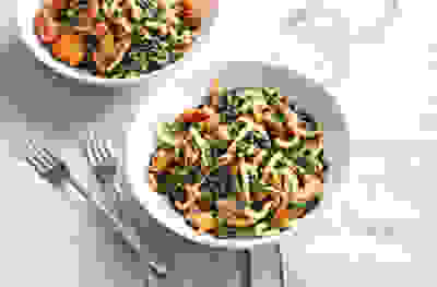 Satay chicken noodles with shredded cavolo nero