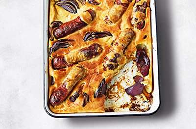 Toad in the hole, with Swiss chard & mustard cream sauce