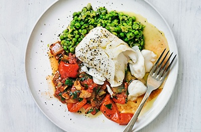 Tomato baked cod with mushy peas