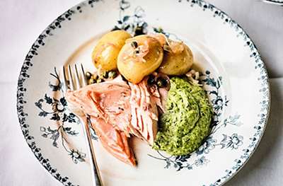 Whole baked salmon with sauce verte