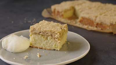 Apple and cinnamon crumble cake with a dollop of crean