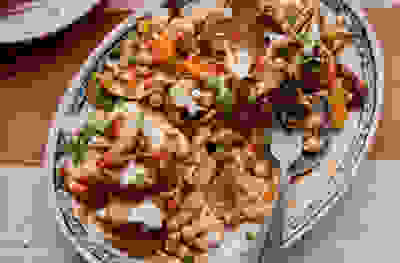 Apricot harissa pulled chicken & chickpea pitta salad 