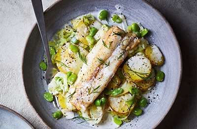 Baked fish with potatoes, dill, leeks & cream sauce