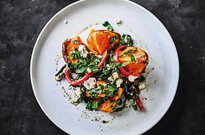 Baked sweet potatoes with peppers & greens
