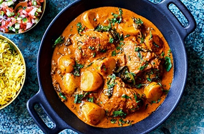 Butter chicken, potato and spinach curry