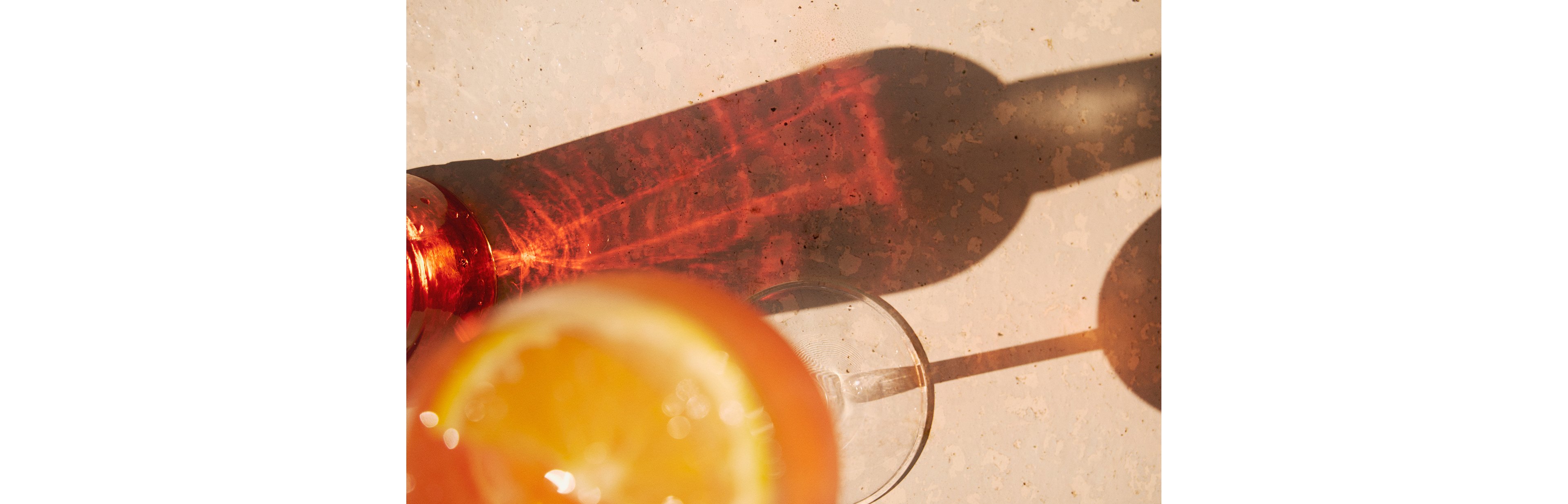 A bottle and a glass of wine