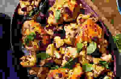 Chicken roasted with cauliflower, aubergines, raisins, pine nuts & capers