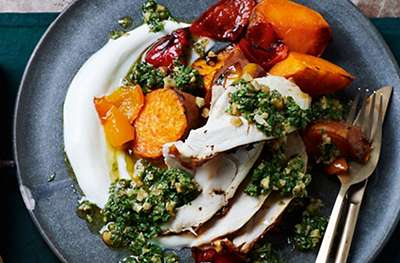 Citrus-rubbed roast chicken with herby walnut salsa & sweet potatoes