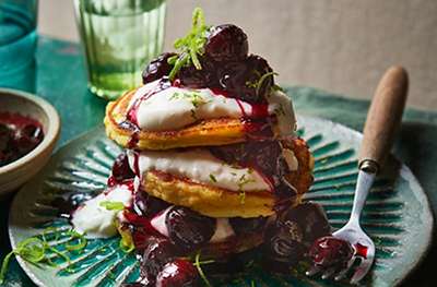 Coconut pancakes with cherry-lime compote