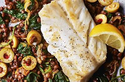 Cod with olives, spinach & lentils