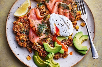 Corn and quinoa fritters with smoked salmon, avocado and a poached egg