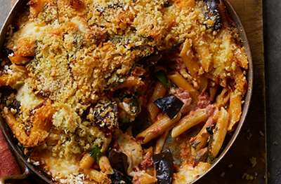 Creamy baked penne with aubergine, spinach & tomato