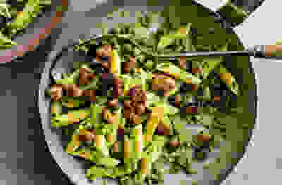 Creamy pea pasta with crispy garlic sausage