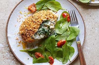 Crusted & feta stuffed chicken with spinach and tomato salad