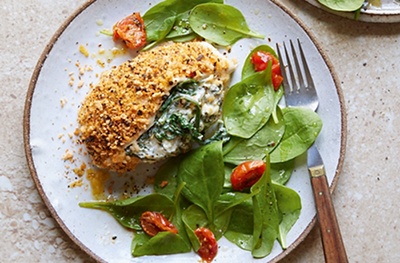 Crusted & feta stuffed chicken with spinach and tomato salad
