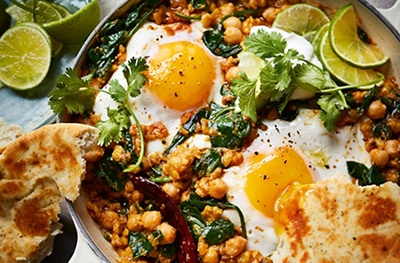 Dal baked eggs with herby yogurt & naan