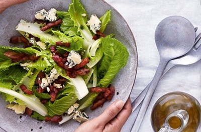 Dolce verde lettuce with hot bacon dressing, chives and crumbled stilton