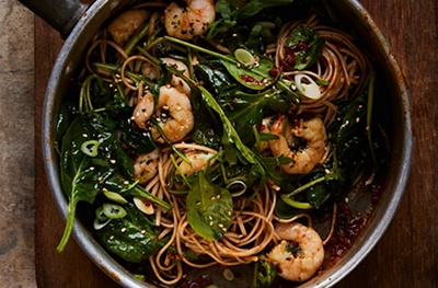 Ginger & chilli soba with salad greens, coriander and king prawns