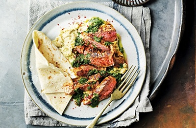 Griddled, spiced lamb with avocado houmous & herb oil