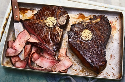 Grilled T-bone steaks with seaweed butter