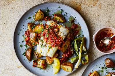 Hake with roast red pepper sauce & charred salad onions