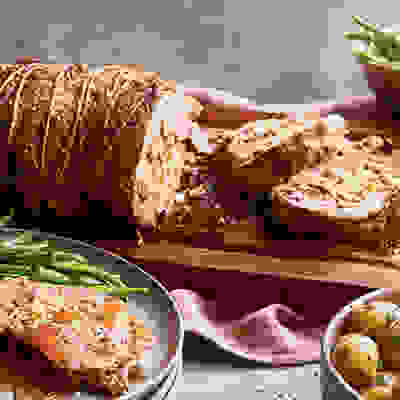 Roast leg of lamb with pistachio, feta & lemon stuffing
