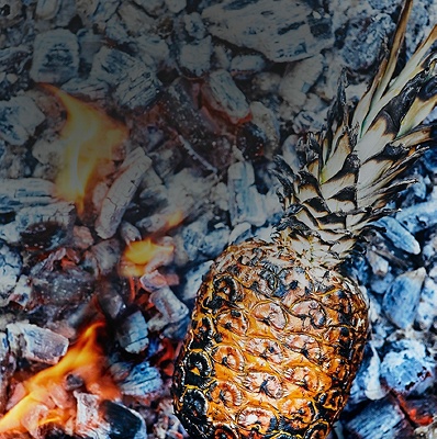 Image of a pineapple on charcoal