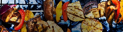 Page header image of kebabs on a bbq