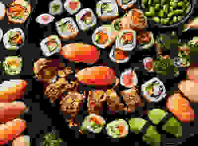 Image of a large platter of various sushi options