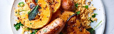Chorizo sausages with roasted squash and herby couscous