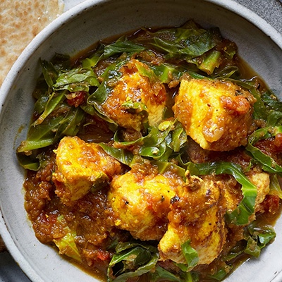 Chicken curry with baby leaf greens