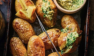 Baby jacket potatoes with smoked garlic butter