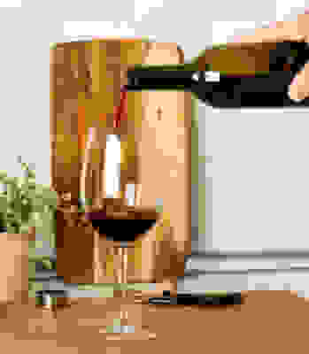 Image of someone pouring Wine