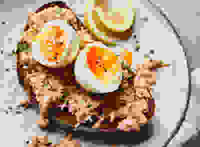 Crab and soft-boiled eggs on toast