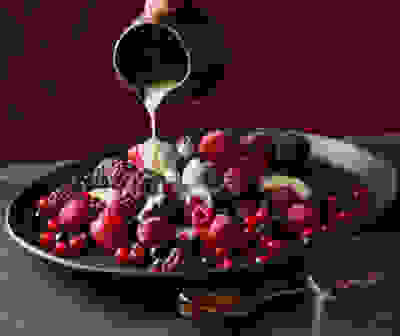 Iced berries with hot limoncello sauce