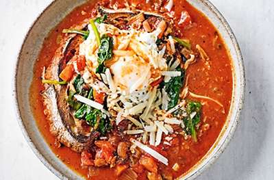 Italian vegetable soup with poached eggs & bread