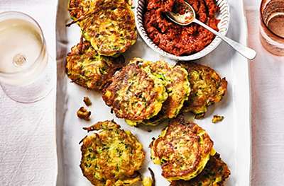 Leek, courgette & sweetcorn fritters with rose harissa pesto