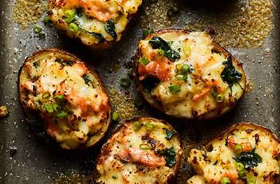 Loaded potato skins with Cheddar, spinach & smoked salmon